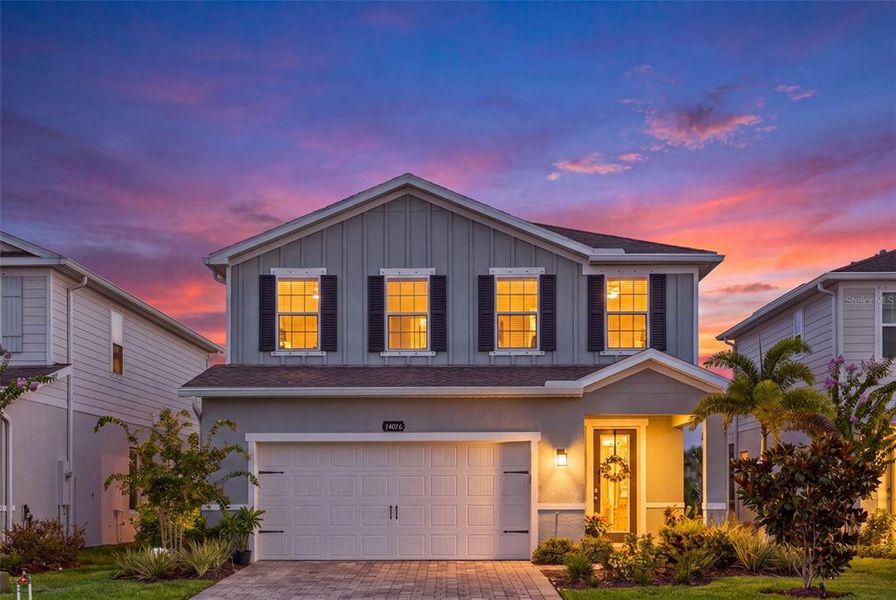 Front exterior of a new home in , Lakewood Ranch, FL, highlighting curb appeal (Image 24).