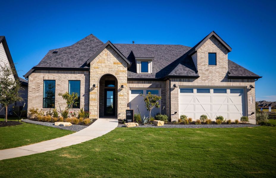 Representative exterior photo of a completed home built from the Renown by Del Webb in Del Webb Austin at Lost Pines, Bastrop, TX (Image 24). Representative exterior photo of a completed home built from the Renown by Del Webb in Del Webb Austin at Lost Pines, Bastrop, TX (Image 24).