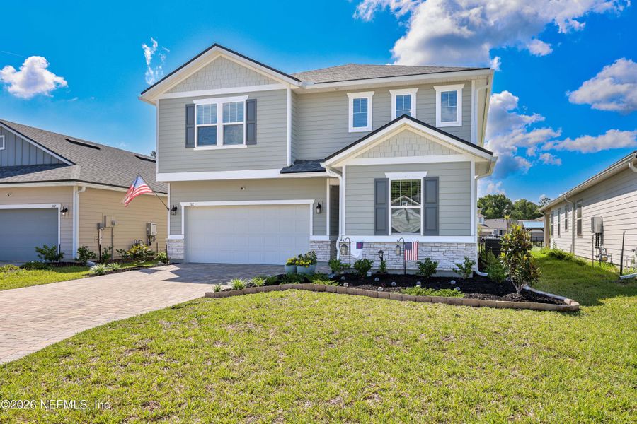 Front exterior of a new home in Elm Creek at Silverleaf, St. Augustine, FL, highlighting curb appeal (Image 24). Front exterior of a new home in Elm Creek at Silverleaf, St. Augustine, FL, highlighting curb appeal (Image 24).