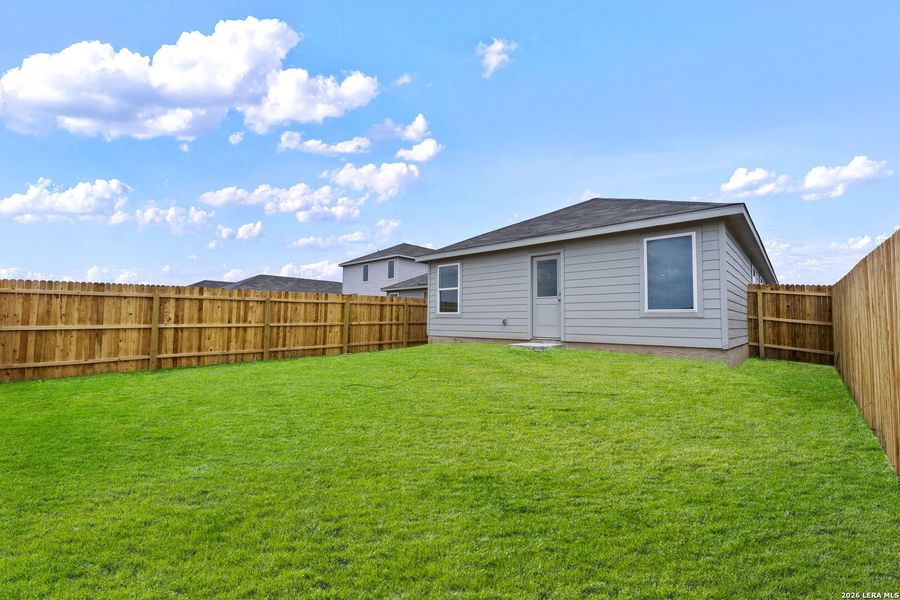 Exterior details and patio area of a home in Spring Grove, St. Hedwig (Image 2).
