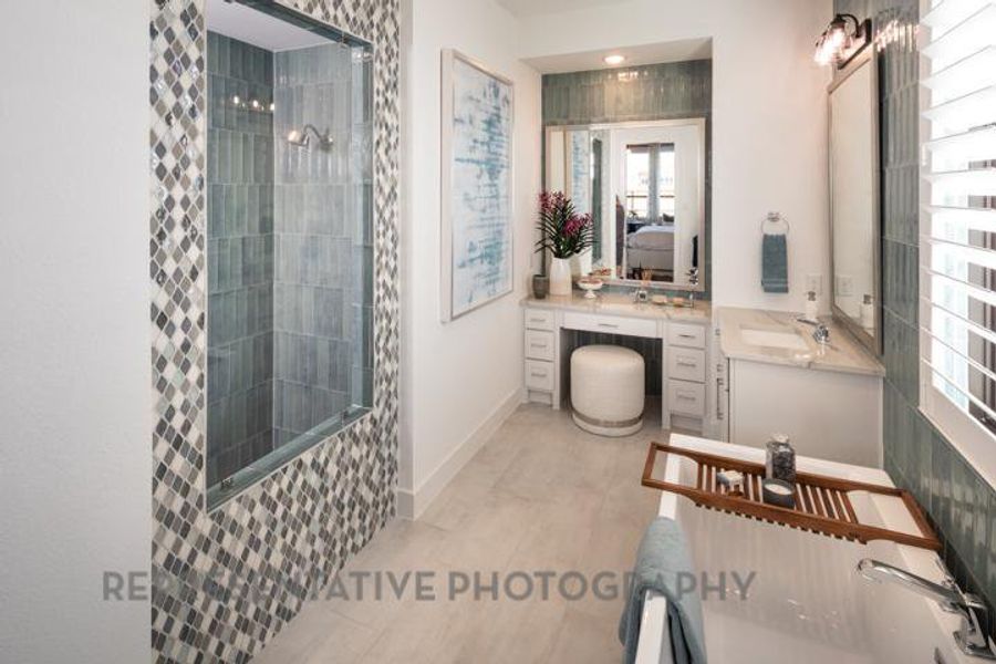 Bathroom featuring vanity and tiled shower Bathroom featuring vanity and tiled shower