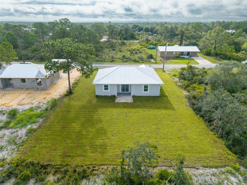 Front exterior of a new home in , Lake Placid, FL, highlighting curb appeal (Image 20).