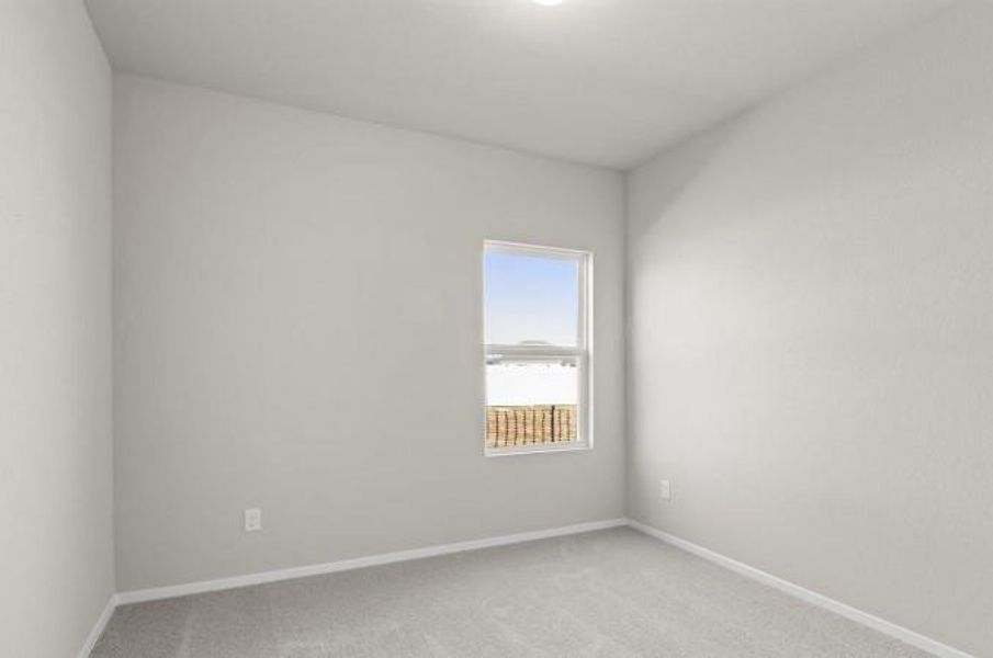 Unfurnished room with light colored carpet and baseboards