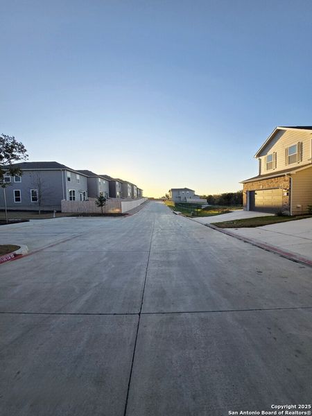 Front exterior of a new home in Cove at Westover Hills, San Antonio, TX, highlighting curb appeal (Image 14).