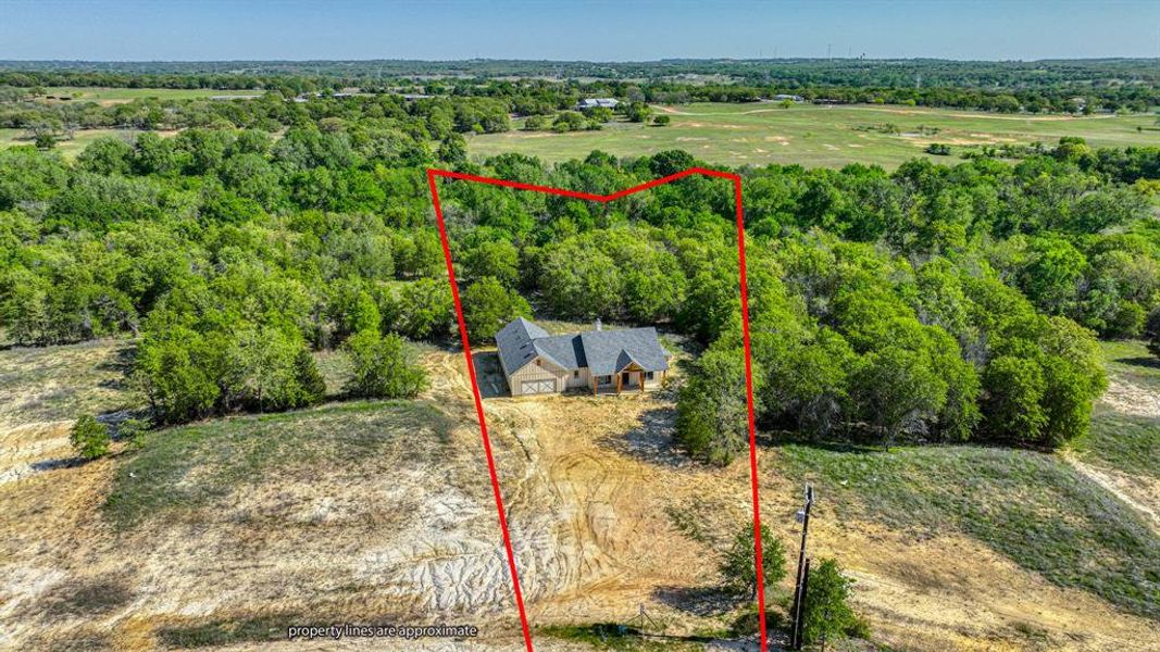 Birds eye view of property with a view of trees Birds eye view of property with a view of trees