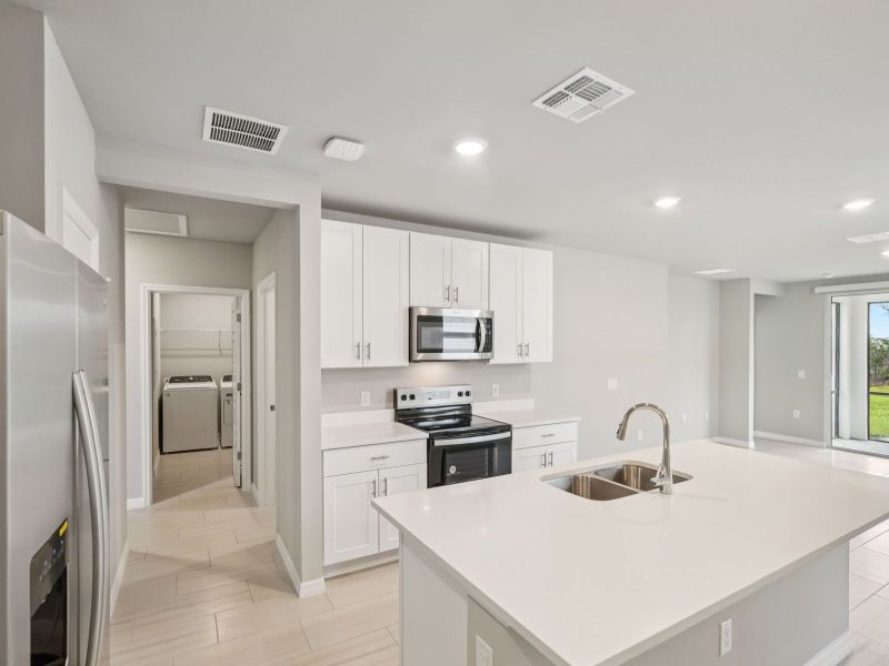 Furnished interior view inside a new home in Crescent Lakes - Premier Series, Punta Gorda (Image 5).
