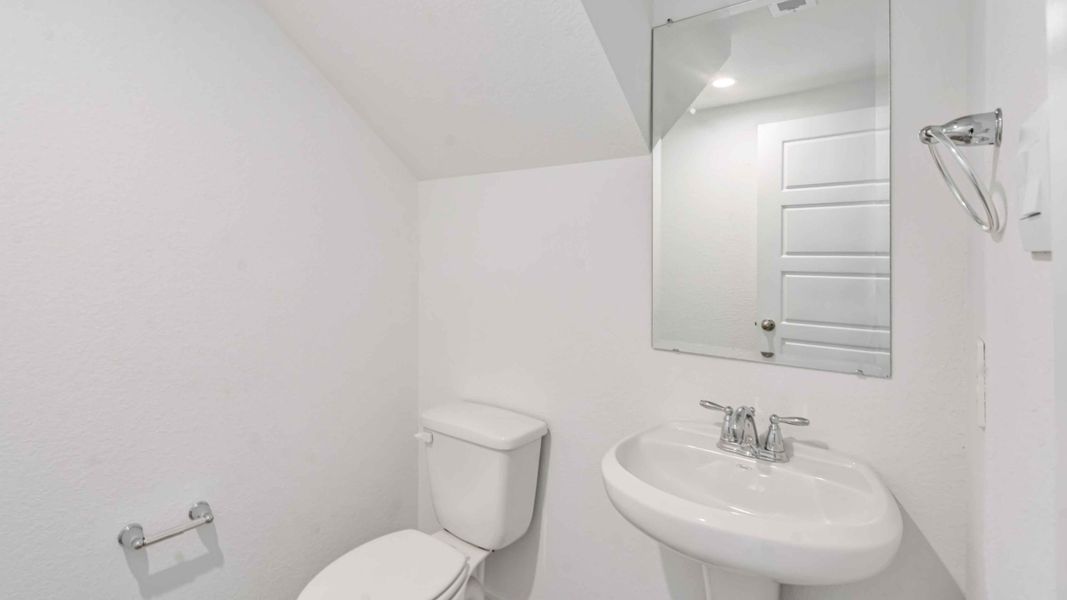 Representative furnished interior of a home built from the Hibiscus by D.R. Horton in City Gate North, Houston (Image 5).