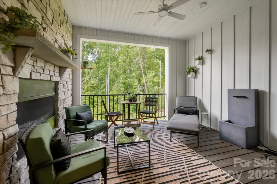 Upgraded Patio w/Stone Wall and Fireplace Upgraded Patio w/Stone Wall and Fireplace