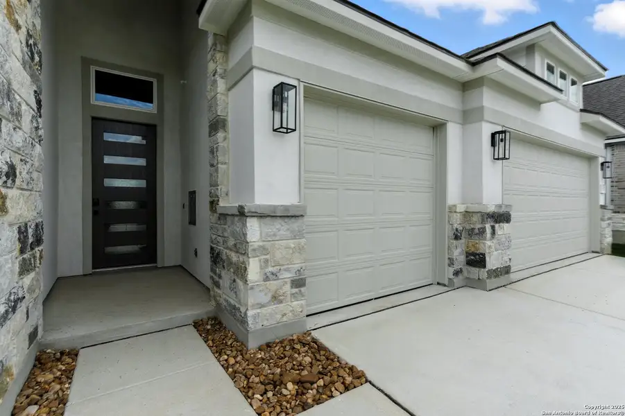 Front exterior of a new home in Weltner Farms 60’s, New Braunfels, TX, highlighting curb appeal (Image 1). Front exterior of a new home in Weltner Farms 60’s, New Braunfels, TX, highlighting curb appeal (Image 1).