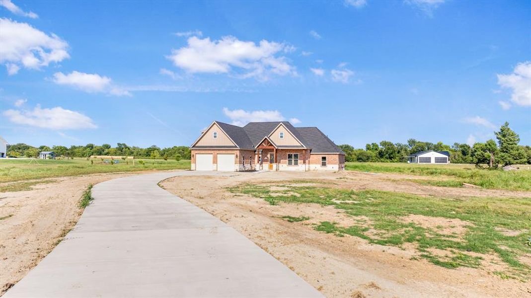 Front exterior of a new home in , Greenville, TX, highlighting curb appeal (Image 17). Front exterior of a new home in , Greenville, TX, highlighting curb appeal (Image 17).