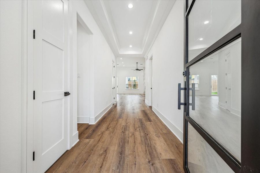 As you open the door, you are greeted by the stunning coffered ceiling and the impressive eight-foot doors, creating an inviting atmosphere that captivates your senses that I'm home. As you open the door, you are greeted by the stunning coffered ceiling and the impressive eight-foot doors, creating an inviting atmosphere that captivates your senses that I'm home.