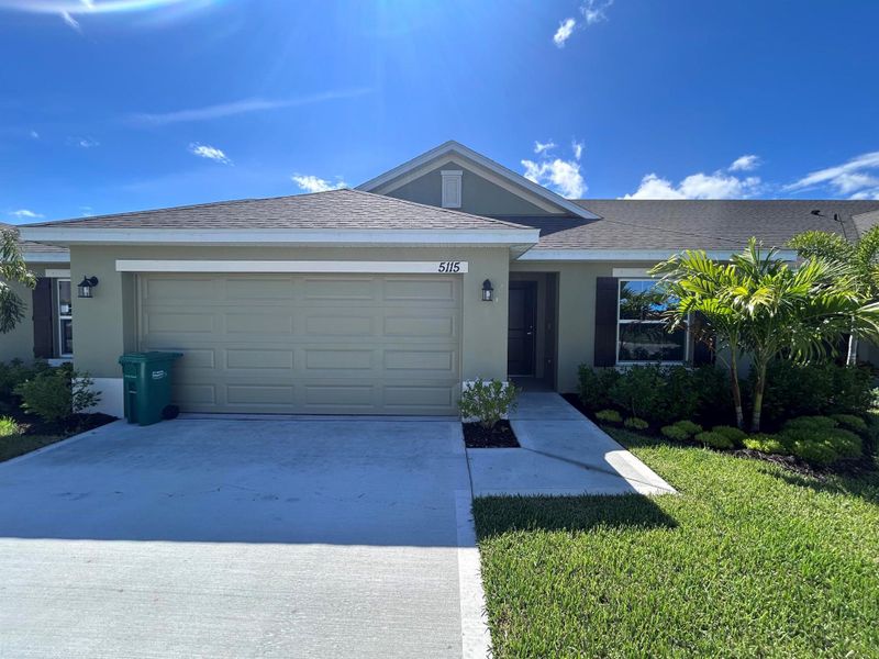 Front exterior of a new home in Waterstone Villas, Fort Pierce, FL, highlighting curb appeal (Image 21). Front exterior of a new home in Waterstone Villas, Fort Pierce, FL, highlighting curb appeal (Image 21).