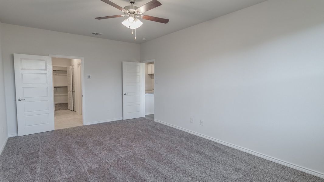 Representative unfurnished interior of a home built from the Medbourne by D.R. Horton in Woodcreek, Fate (Image 9).