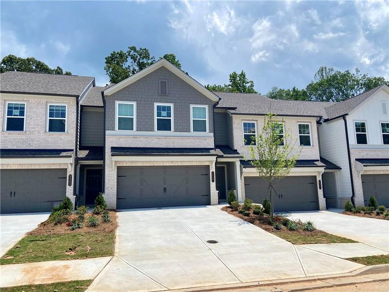 Front exterior of a new home in Eastlyn Crossing, Flowery Branch, GA, highlighting curb appeal (Image 16).