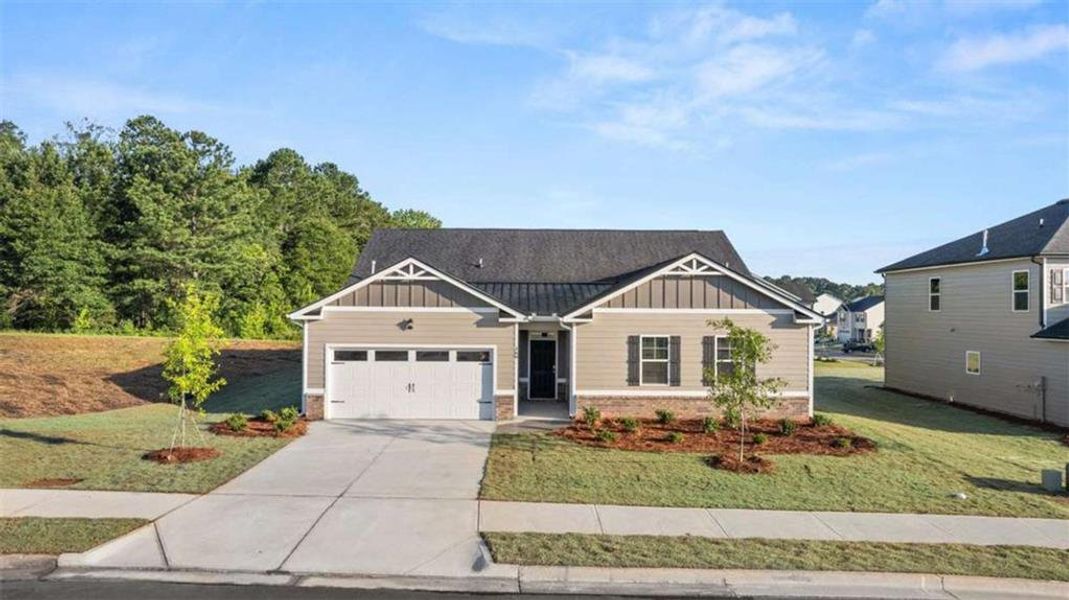 Front exterior of a new home in Preserve at Dove Creek, Statham, GA, highlighting curb appeal (Image 1).