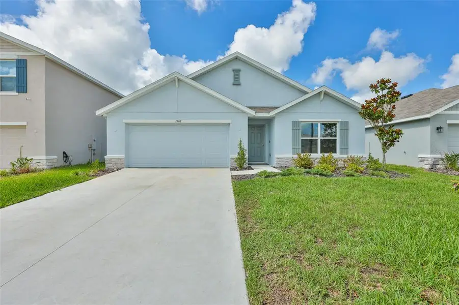 Front exterior of a new home in North Park Isle, Plant City, FL, highlighting curb appeal (Image 1). Front exterior of a new home in North Park Isle, Plant City, FL, highlighting curb appeal (Image 1).