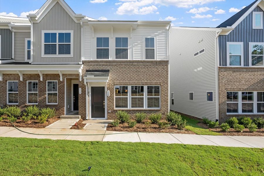 Front exterior of a new home in Renaissance at White Oak, Garner, NC, highlighting curb appeal (Image 1). Front exterior of a new home in Renaissance at White Oak, Garner, NC, highlighting curb appeal (Image 1).