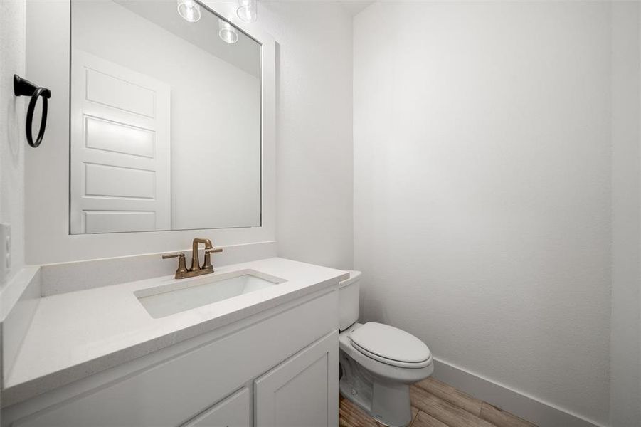 Bathroom featuring vanity and wood finished floors
