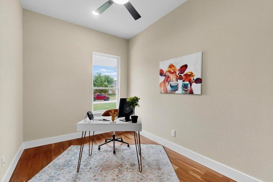 Office with a ceiling fan and wood finished floors