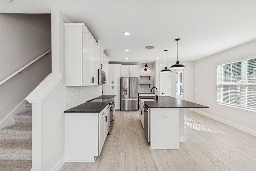Furnished interior view inside a new home in Aspire at Canter Creek, Davenport (Image 4).