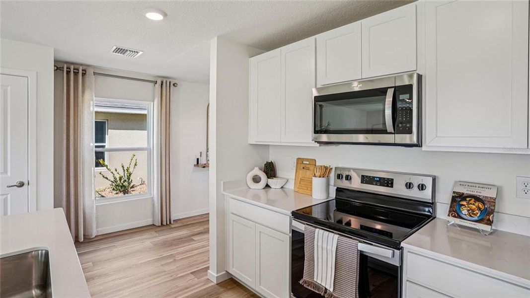 Furnished interior view inside a new home in Twisted Oaks, Wildwood (Image 9).