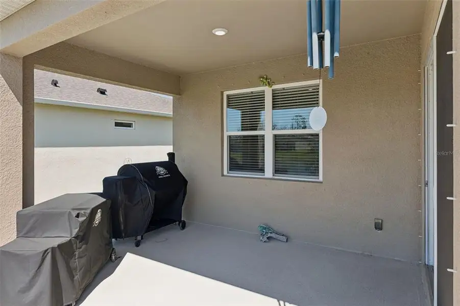 Exterior details and patio area of a home in , New Smyrna Beach (Image 4).
