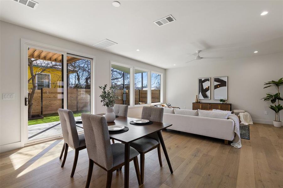 Enjoy the perfect blend of indoor elegance and outdoor serenity with sliding doors opening to a picturesque back patio.