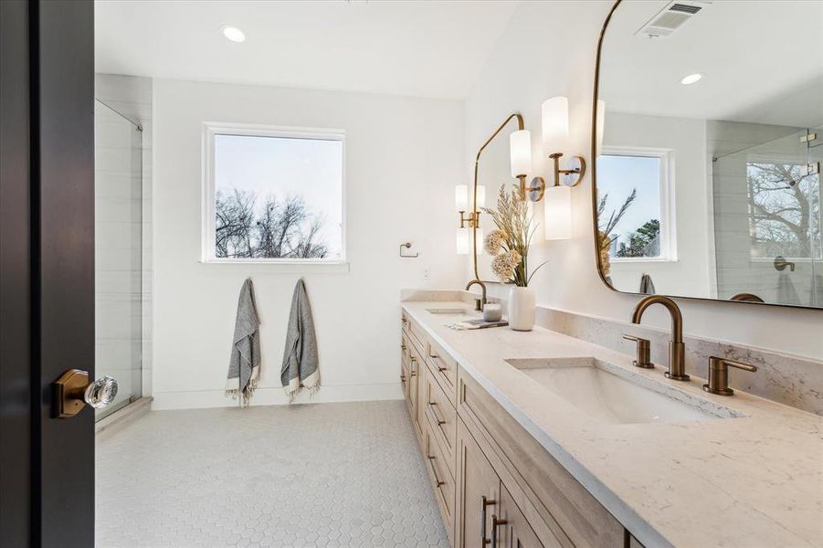 Soak in the natural light as you get ready in your primary bathroom.