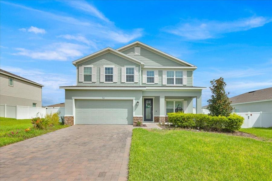 Front exterior of a new home in , Apopka, FL, highlighting curb appeal (Image 20).
