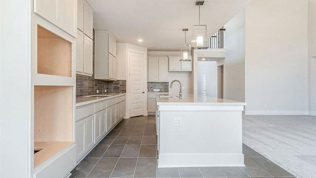 Furnished interior view inside a new home in Sunterra, Katy (Image 14).