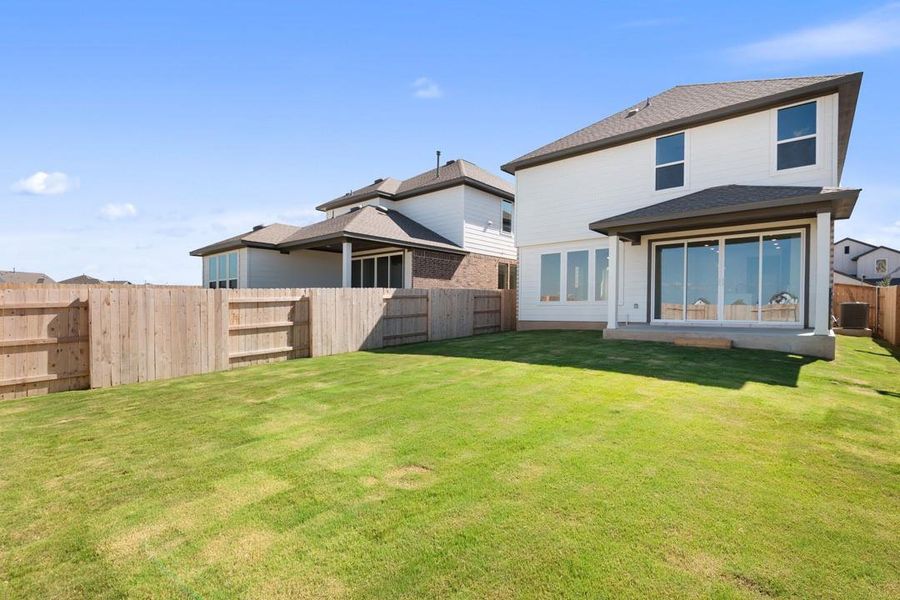 Front exterior of a new home in Terrace Collection at Lariat, Liberty Hill, TX, highlighting curb appeal (Image 1). Front exterior of a new home in Terrace Collection at Lariat, Liberty Hill, TX, highlighting curb appeal (Image 1).