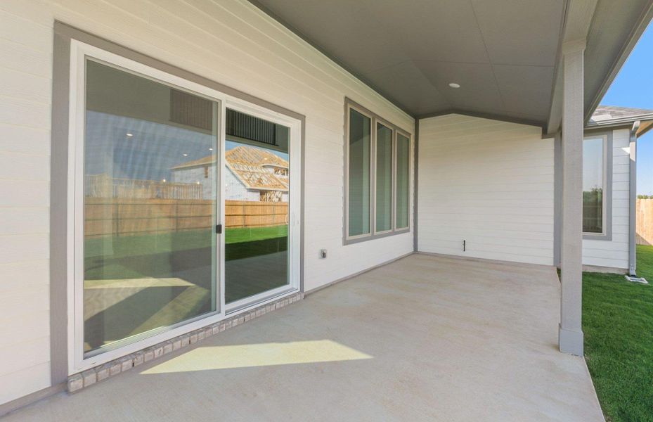 Front exterior of a new home in Kuempel Estates, Pflugerville, TX, highlighting curb appeal (Image 20). Front exterior of a new home in Kuempel Estates, Pflugerville, TX, highlighting curb appeal (Image 20).