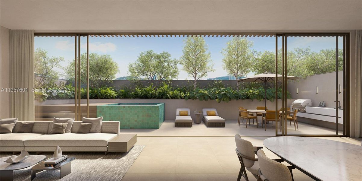 Exterior patio with heated pool and summer kitchen