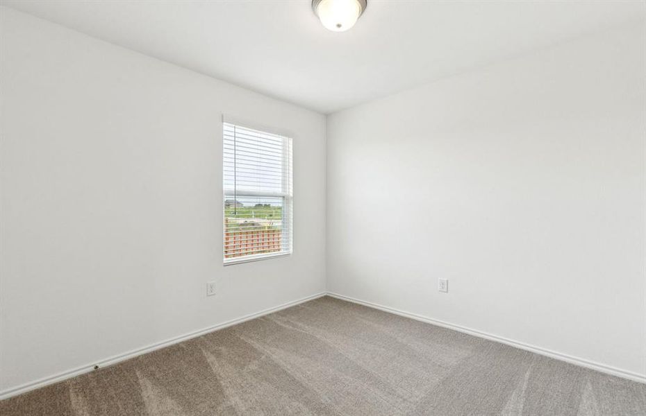 Spacious secondary bedroom with large window