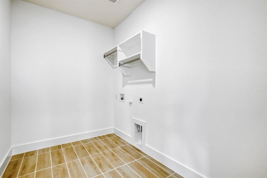 Laundry area featuring hookup for an electric dryer, washer hookup, and gas dryer hookup