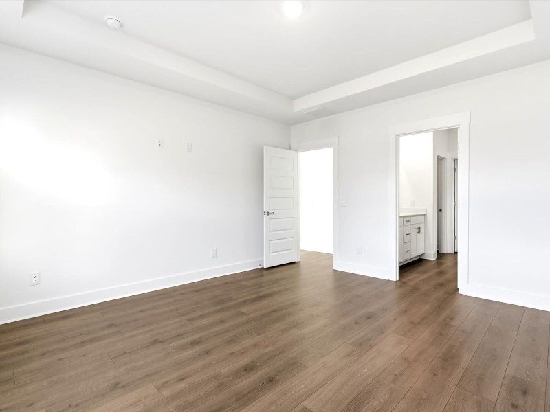 Spacious, unfurnished interior of a new home in The Coves at Lakes of Cane Bay, Summerville (Image 17).