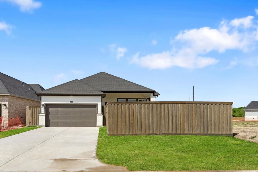 Front exterior of a new home in Riceland, Mont Belvieu, TX, highlighting curb appeal (Image 13).