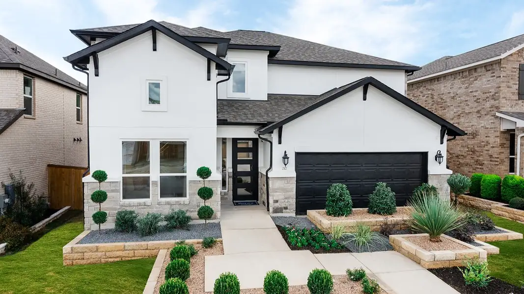 Representative exterior photo of a completed home built from the Saffron by Taylor Morrison in Travisso, Leander, TX (Image 1). Representative exterior photo of a completed home built from the Saffron by Taylor Morrison in Travisso, Leander, TX (Image 1).