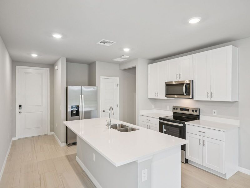 Furnished interior view inside a new home in Crescent Lakes - Premier Series, Punta Gorda (Image 4).