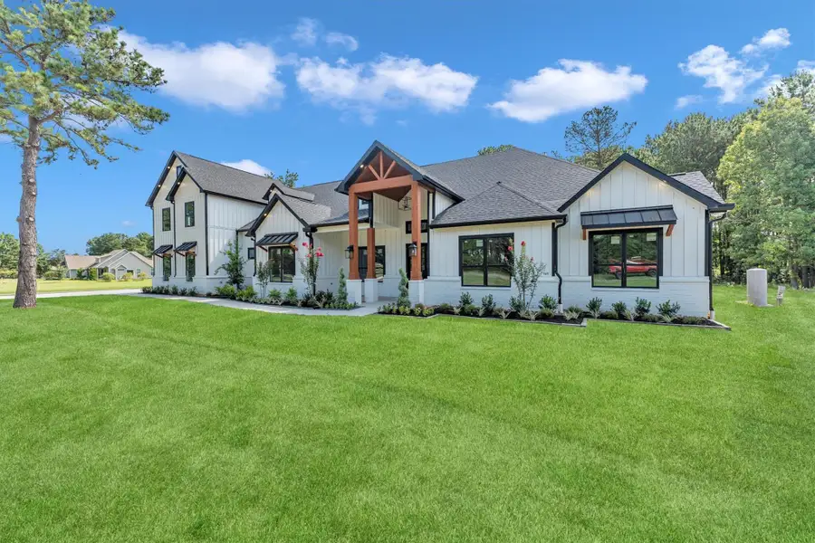 Front exterior of a new home in , Conroe, TX, highlighting curb appeal (Image 1).