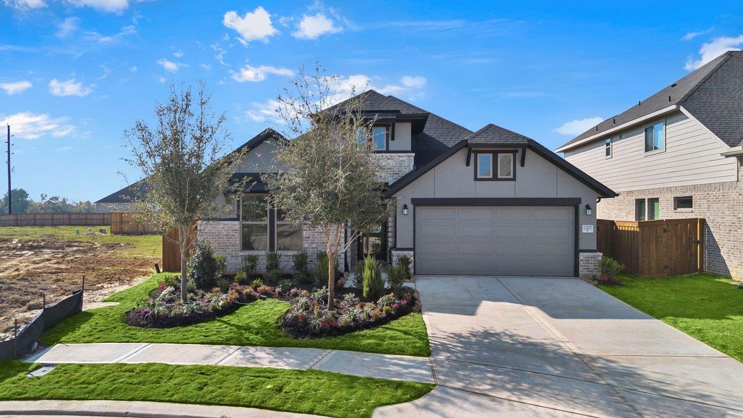 Front exterior of a new home in Dunham Pointe 50', Cypress, TX, highlighting curb appeal (Image 19).