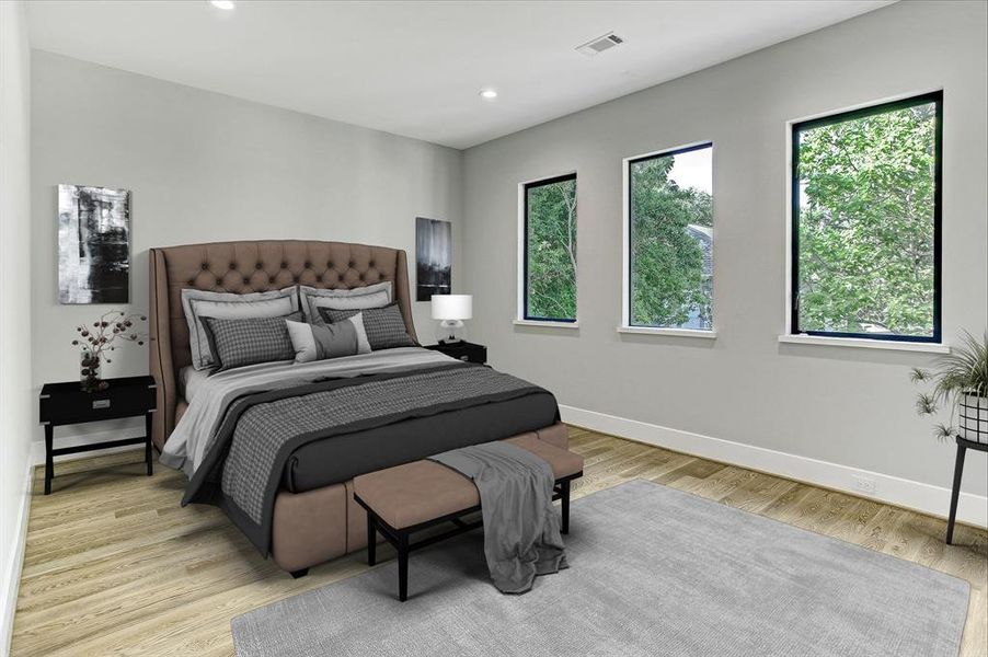 Large and lovely master bedroom overlooking the lush backyard.