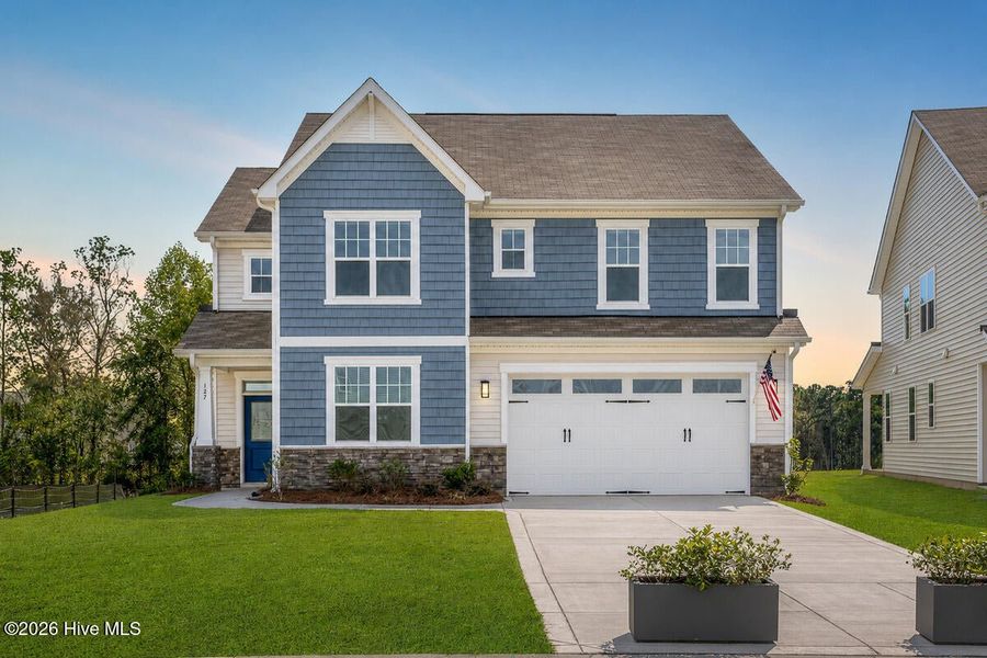 Front exterior of a new home in Coastal Haven, Leland, NC, highlighting curb appeal (Image 8).