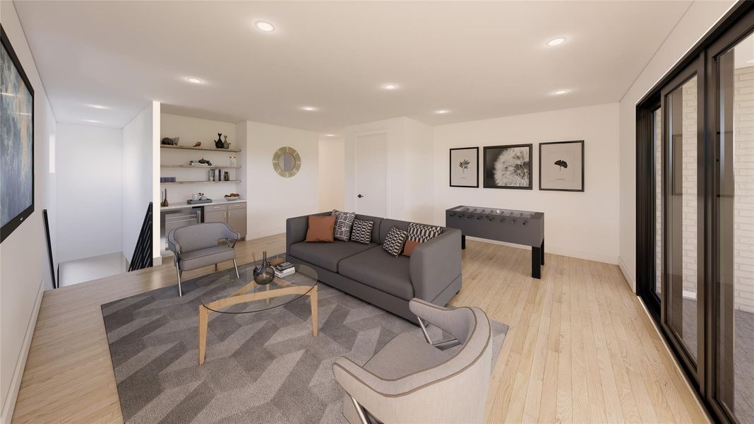 Perfect for gathering and relaxing, the spacious third-floor game room features a dry bar with beverage refrigerator and opens to a covered balcony with an outdoor fireplace Perfect for gathering and relaxing, the spacious third-floor game room features a dry bar with beverage refrigerator and opens to a covered balcony with an outdoor fireplace