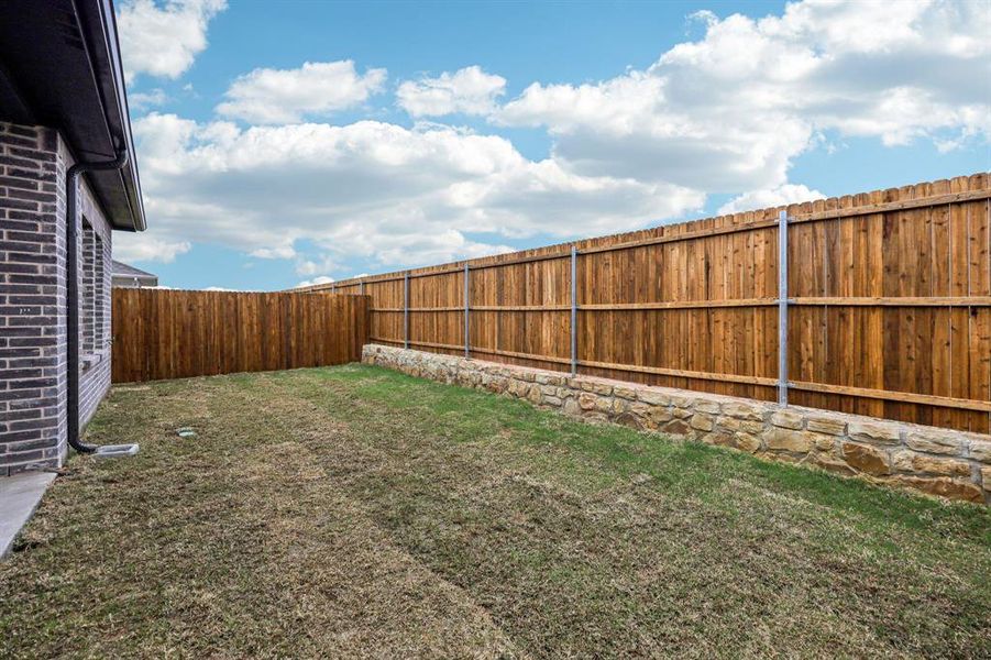 Exterior details and patio area of a home in Parks at Foster Crossing - Spring Series, Anna (Image 27).