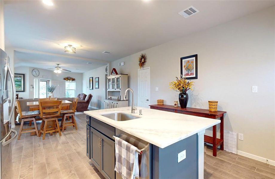 Added spotlights create lighted work areas in the kitchen.