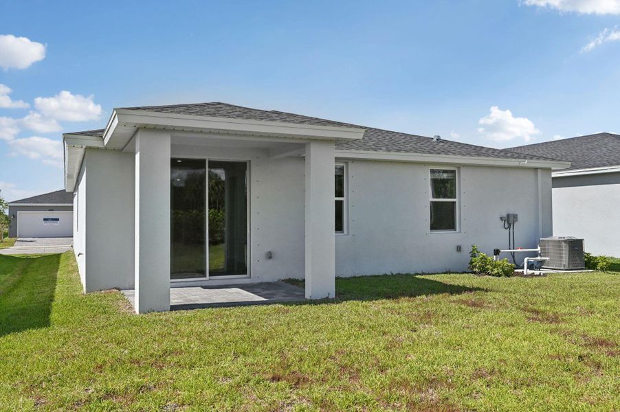 Front exterior of a new home in Hampton Park - Classic Series, Vero Beach, FL, highlighting curb appeal (Image 1). Front exterior of a new home in Hampton Park - Classic Series, Vero Beach, FL, highlighting curb appeal (Image 1).