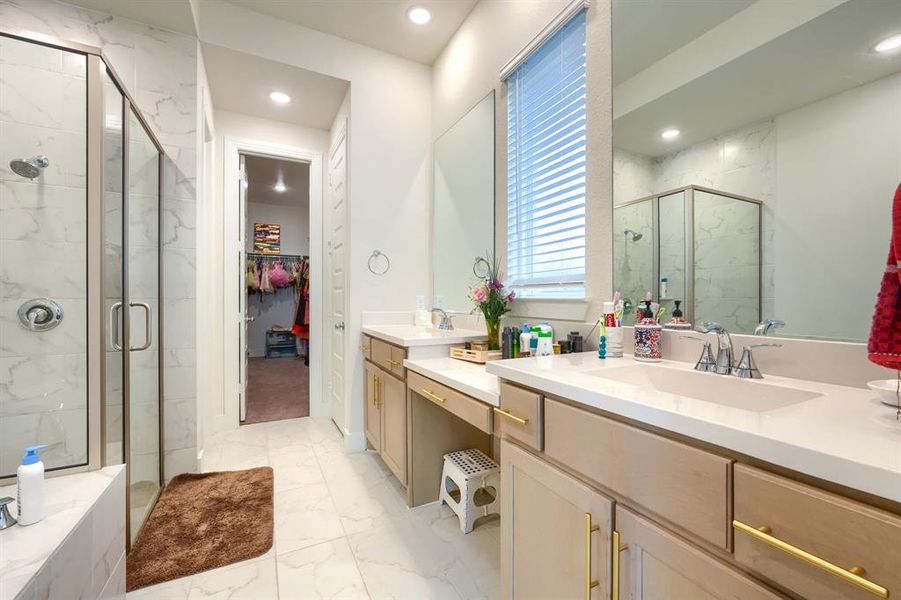 Bathroom featuring vanity and walk in shower