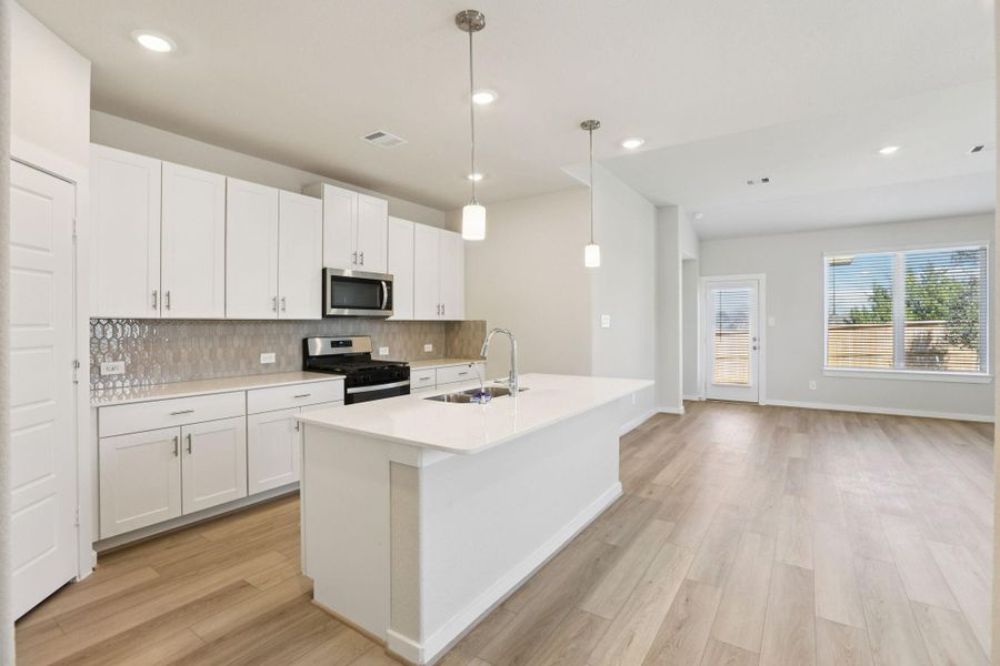 Photos are not of the actual home, but are photos of the builder home with same floorplan with similar interior finishes.