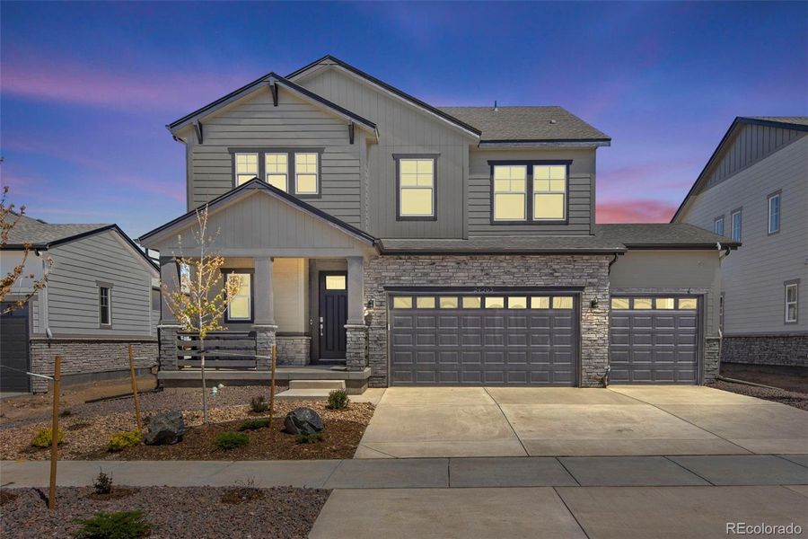 Front exterior of a new home in Prelude at The Aurora Highlands, Aurora, CO, highlighting curb appeal (Image 24).